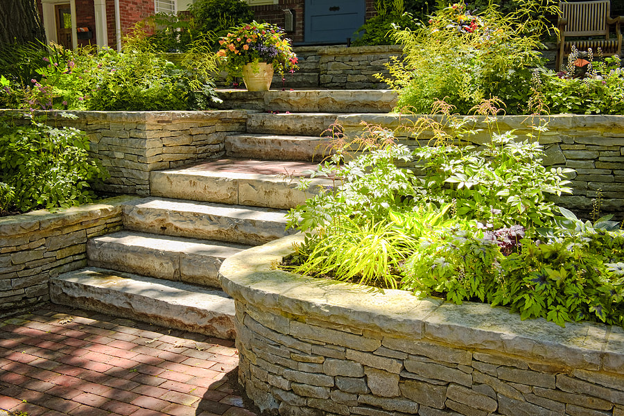 Flagstone pavers are inlaid next to an array of natural fauna,